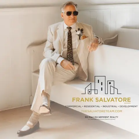 Frank Salvatore in white suit - Logo lower right